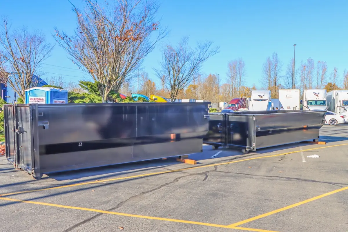 Professional dumpster rental service with roll-off container on residential driveway in Palos Heights